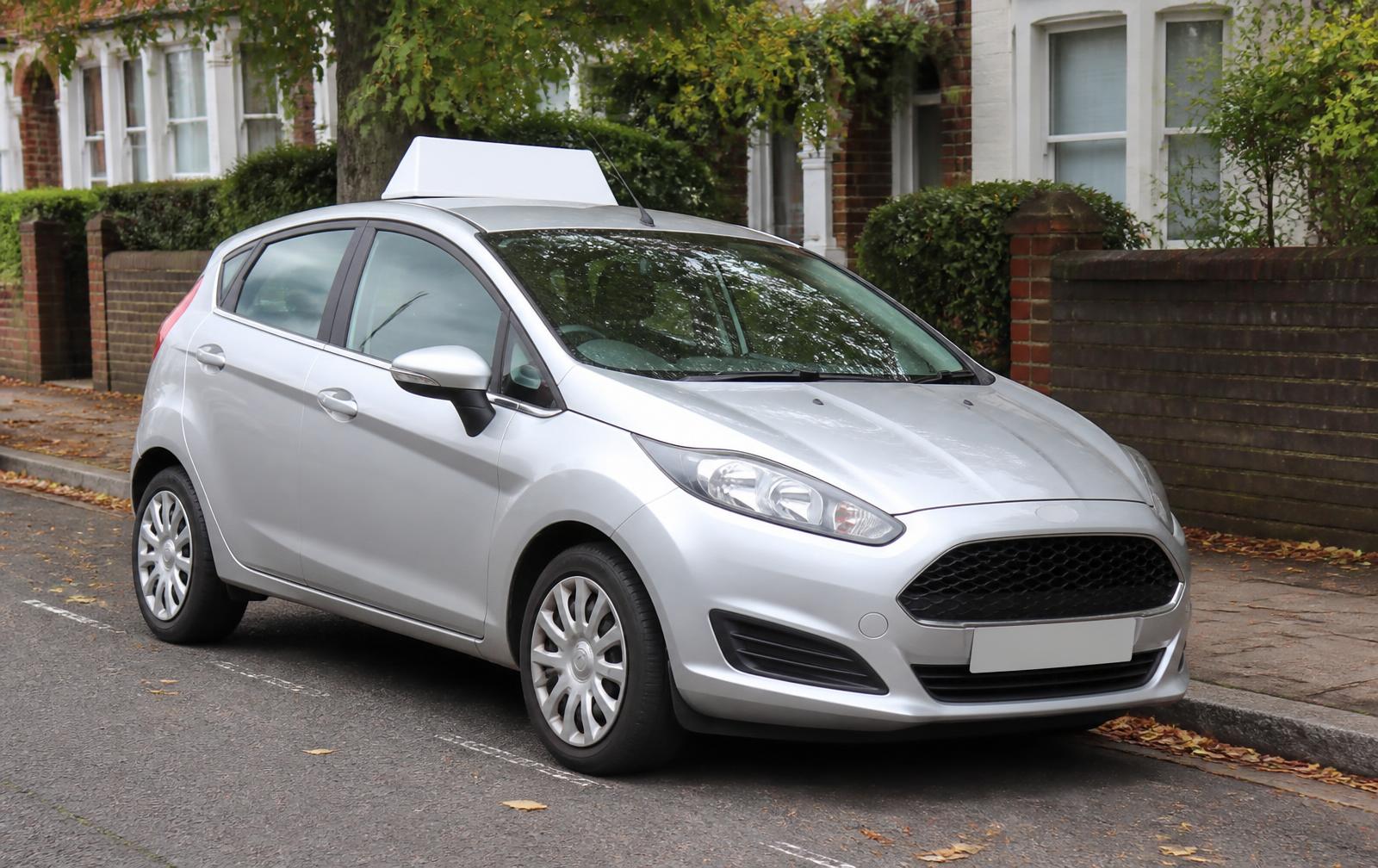 Learner car with a roof sign parked on a South London street